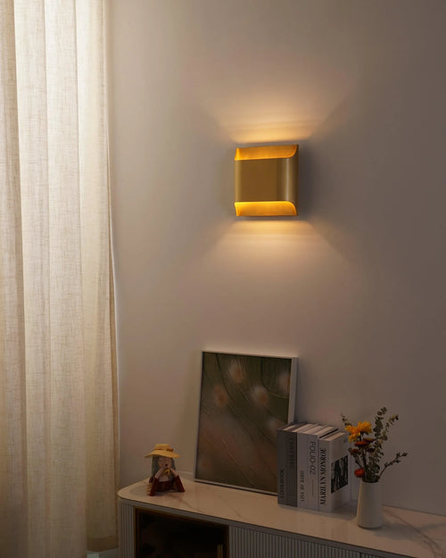 Modern Metal Up and Down Wall Sconce in Evening Interior