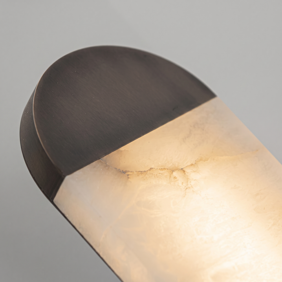 Close Up View of Bronze End Cap and Translucent Alabaster Stone