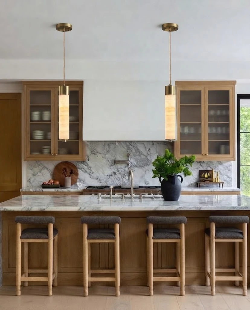 Modern Cylindrical Alabaster Pendant Lights Over Kitchen Counter