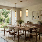 Modern Cylindrical Alabaster Pendant Lights Over Dining Table