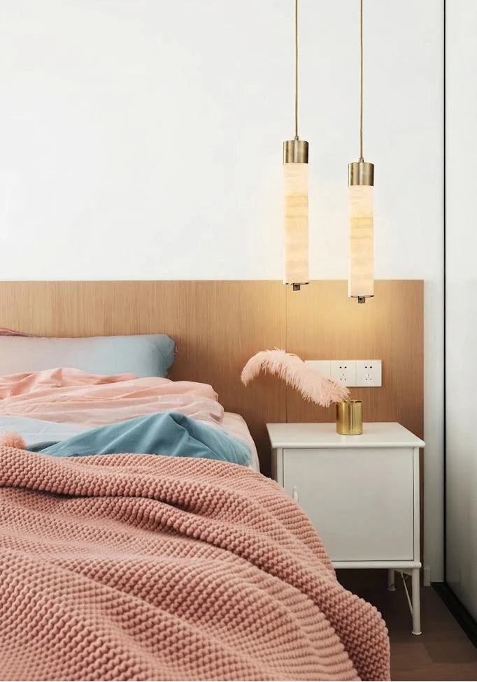 Modern Cylindrical Alabaster Pendant Lights Over Bedroom Bed