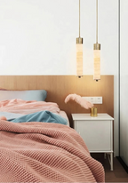 Modern Cylindrical Alabaster Pendant Lights Over Bedroom Bed