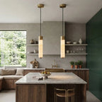 Modern Cylindrical Alabaster Pendant Light Over Kitchen Island