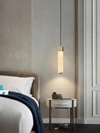 Modern Cylindrical Alabaster Pendant Light Over Bedroom Nightstand