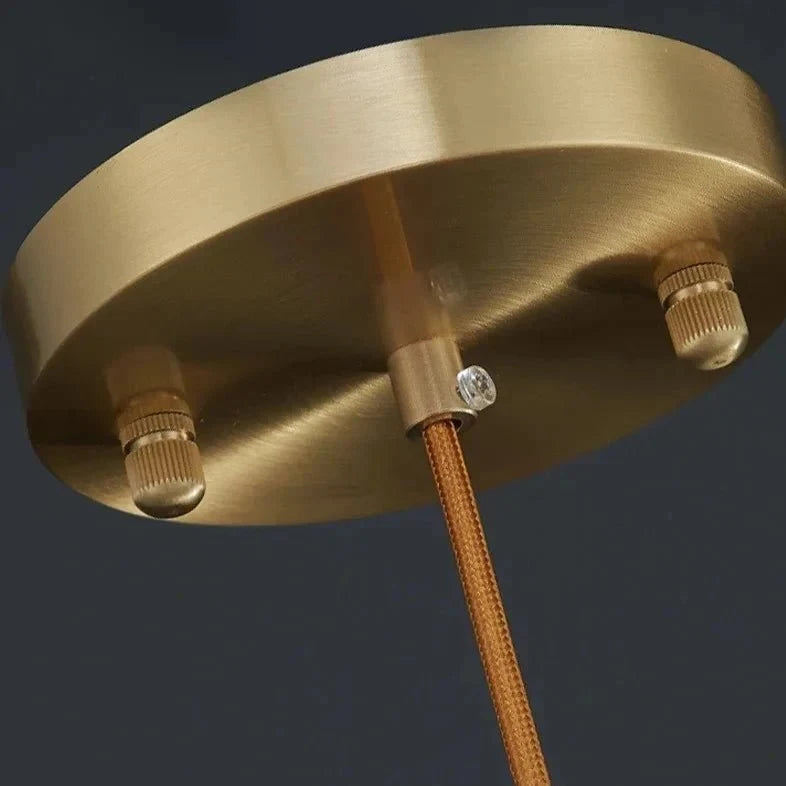 Close Up View of Brass Canopy and Suspension Cord