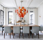 Modern Orange-Red Iridescent Round Disc Art Glass Chandelier in Elegant Dining Area