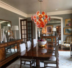 Modern Silver Frame Orange-Red Iridescent Chandelier in Luxury Dining Room
