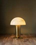 Illuminated Modern Brass Alabaster Mushroom Table Lamp Studio Shot on Dark Background
