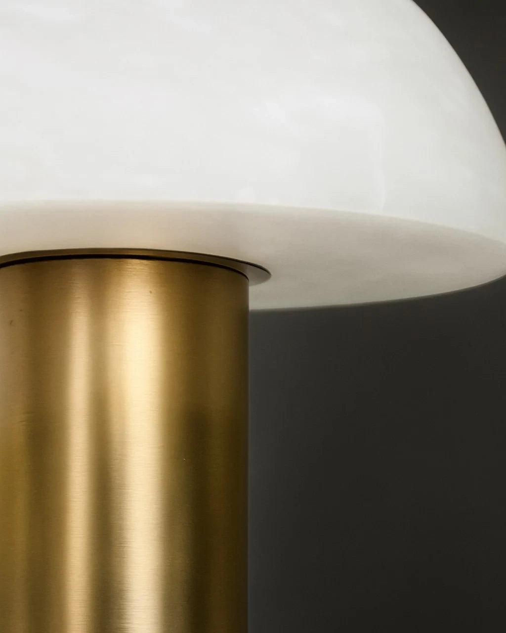 Close Up View of Modern Brass Rod and Alabaster Mushroom Shade Connection Details