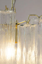 Close Up View of Illuminated Fluted Art Glass Tubes and Brass Connectors