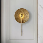 Modern Textured Disc Wall Sconce in Elegant Living Space