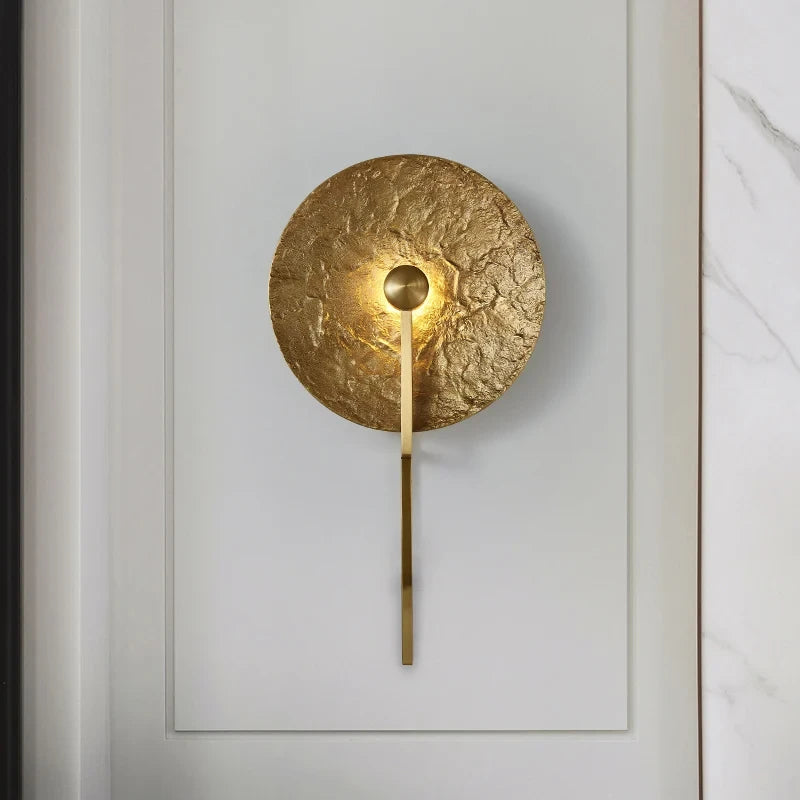 Modern Textured Disc Wall Sconce in Elegant Living Space