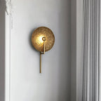 Modern Textured Disc Wall Sconce in Elegant Hallway Corridor