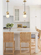 Modern Disc and Globe Pendant Light Over Kitchen Dining Area