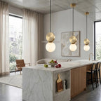 Modern Disc and Globe Pendant Lights Over Kitchen Island