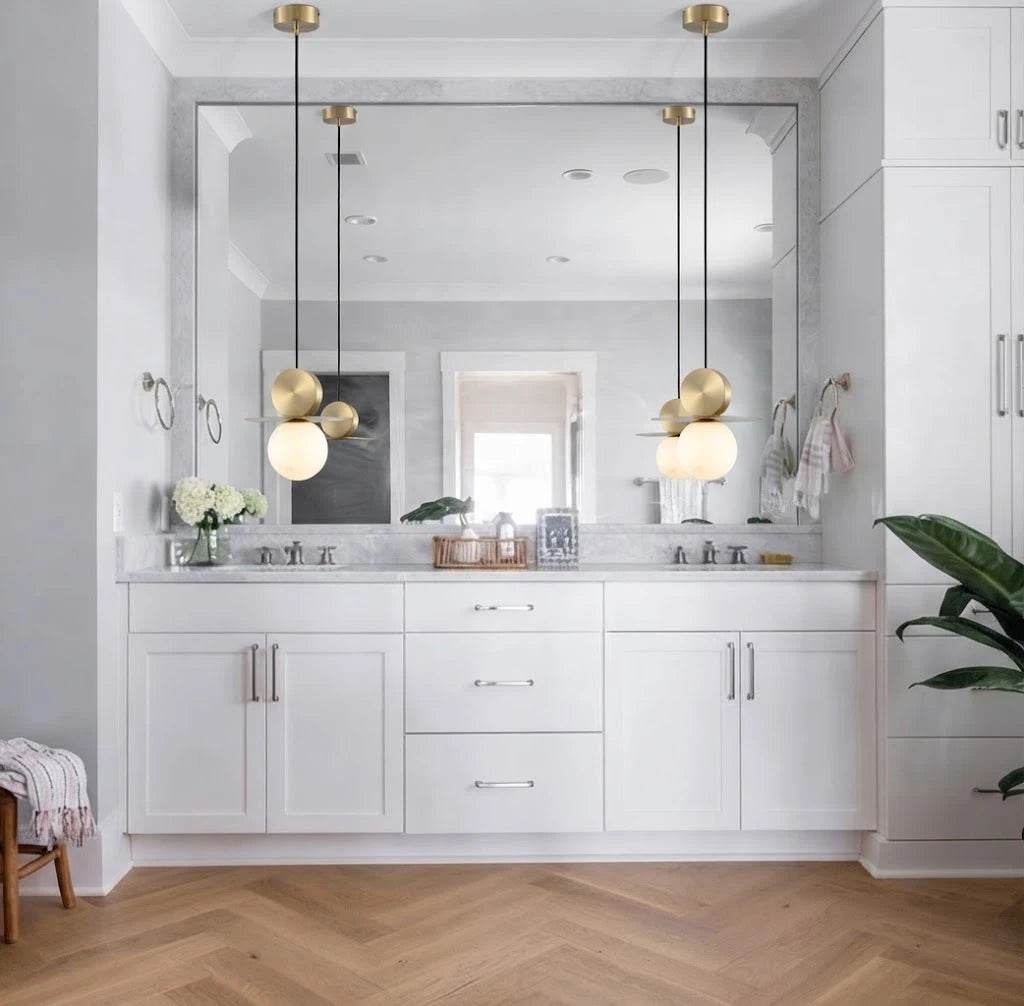 Modern Disc and Globe Pendant Lights in Bathroom Vanity Setting