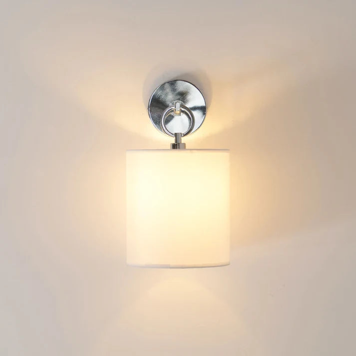 Glowing Chrome Wall Sconce Ambient Warm Light Effect