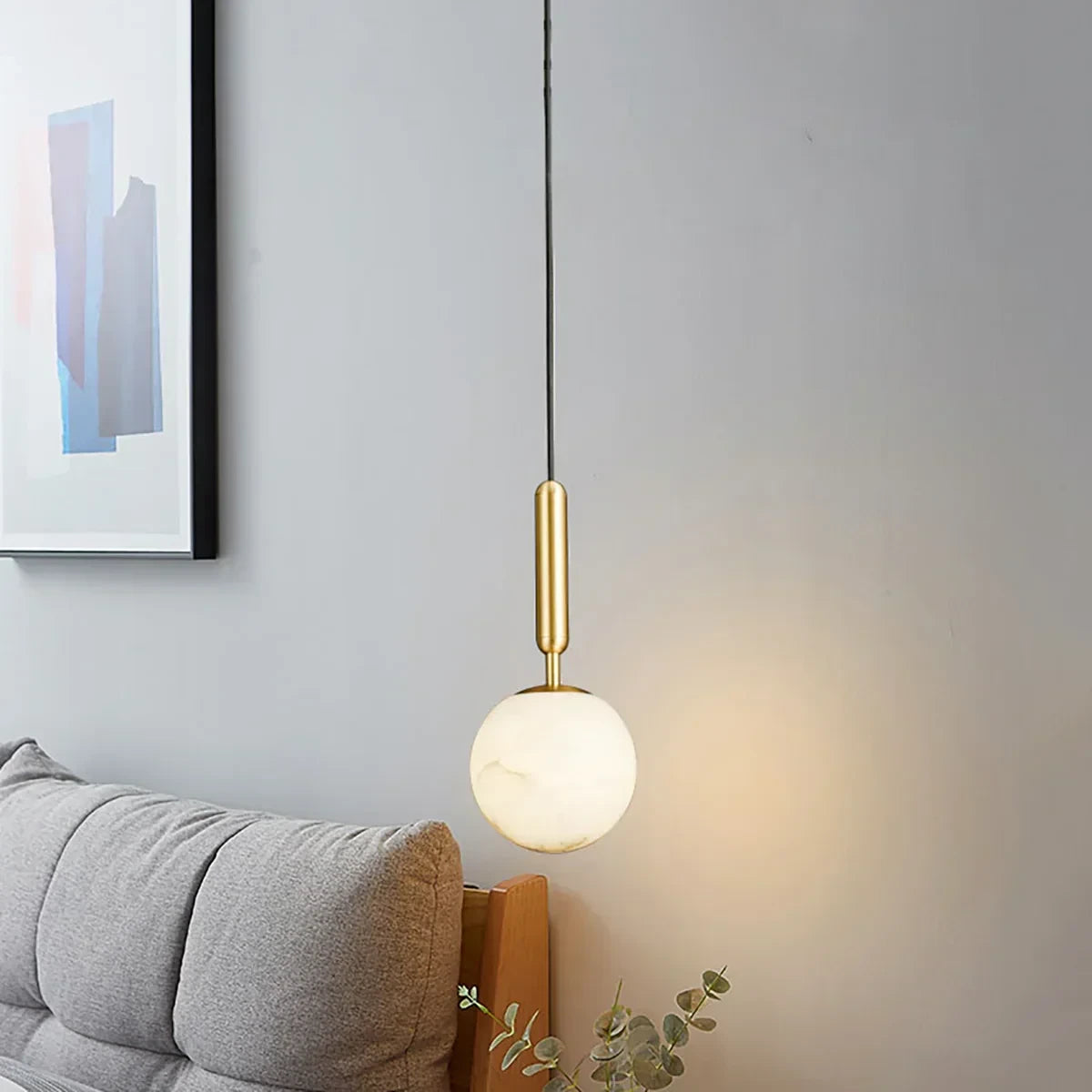 Modern Alabaster Globe Pendant Light Over Living Room Seating Area