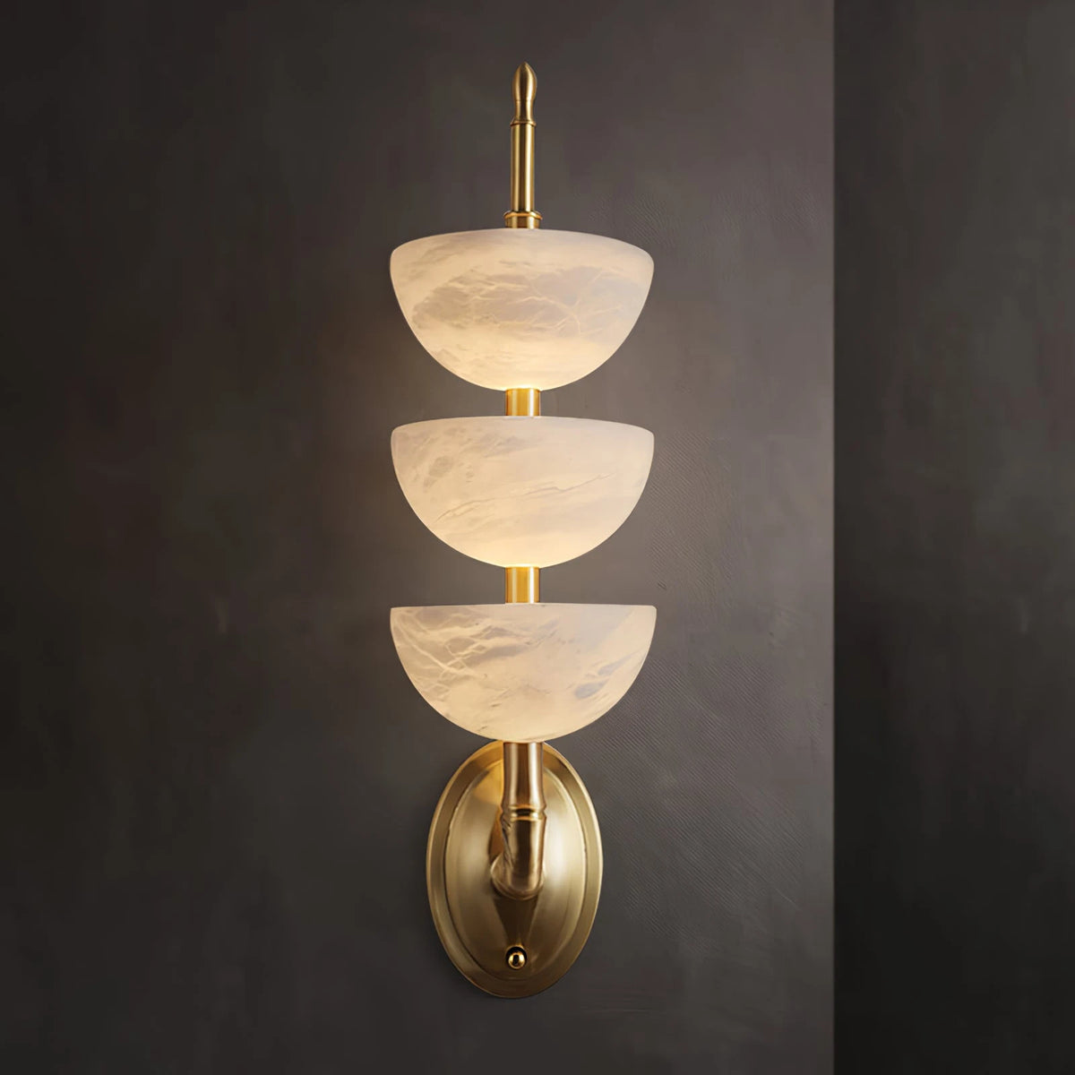 Glowing 3-Tier Alabaster Wall Light on Dark Background