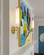 Modern Alabaster Wall Sconce Beside Artwork in Interior