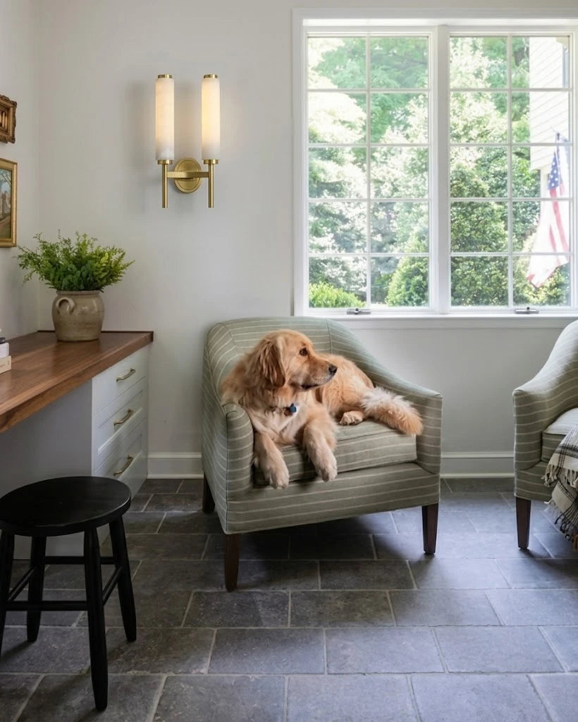 Modern Brass Cylinder Wall Sconce in Living Room Corner
