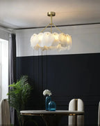Modern Natural Shell Chandelier Over Round Dining Table