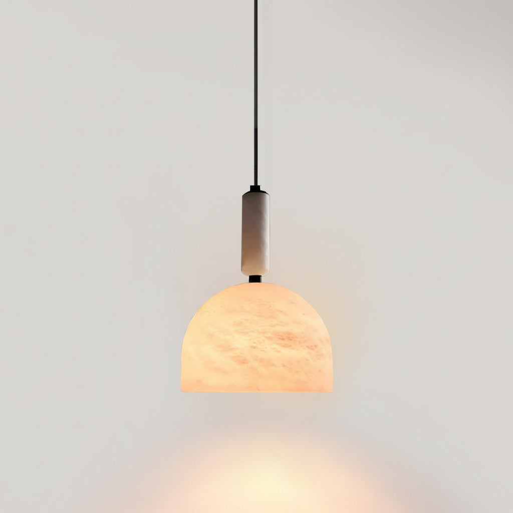 Warm glowing Cairo Dome alabaster pendant lamp against plain light wall