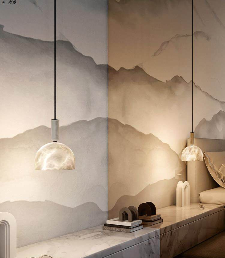 Pair of Cairo Dome alabaster pendant lights above long vanity mountain mural wall