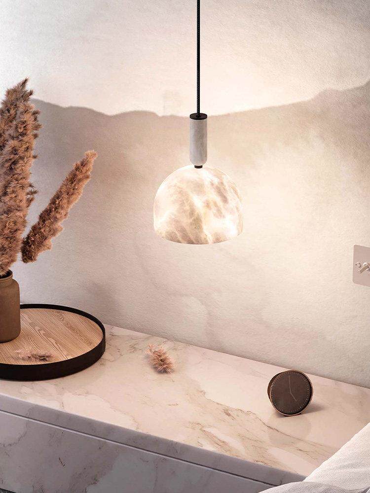 Lit Cairo Dome Alabaster Pendant Light above vanity counter neutral interior decor