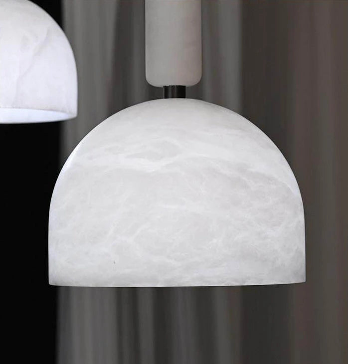 Close Up View of Illuminated Natural Marble Dome Pendant Light Canopy on Dark Background