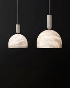 Illuminated Modern Natural Marble Dome Pendant Lights Studio Display on Black Background
