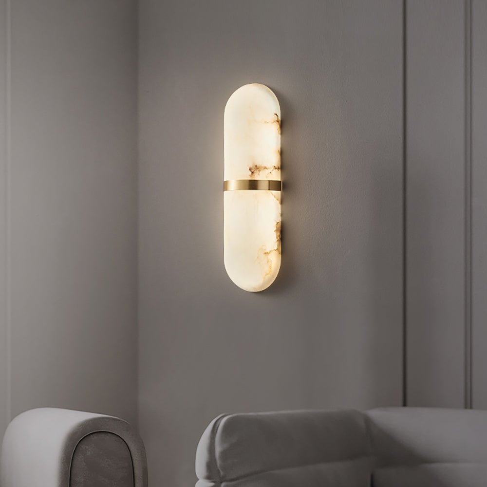 Lit Capsule Alabaster Sconce simple grey wall modern interior scene