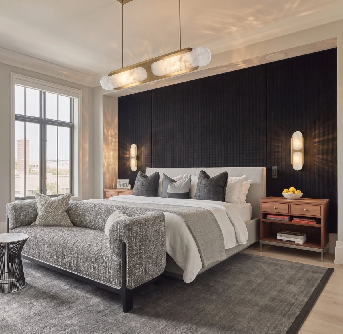 Modern Brass and Travertine Wall Sconces in Master Bedroom