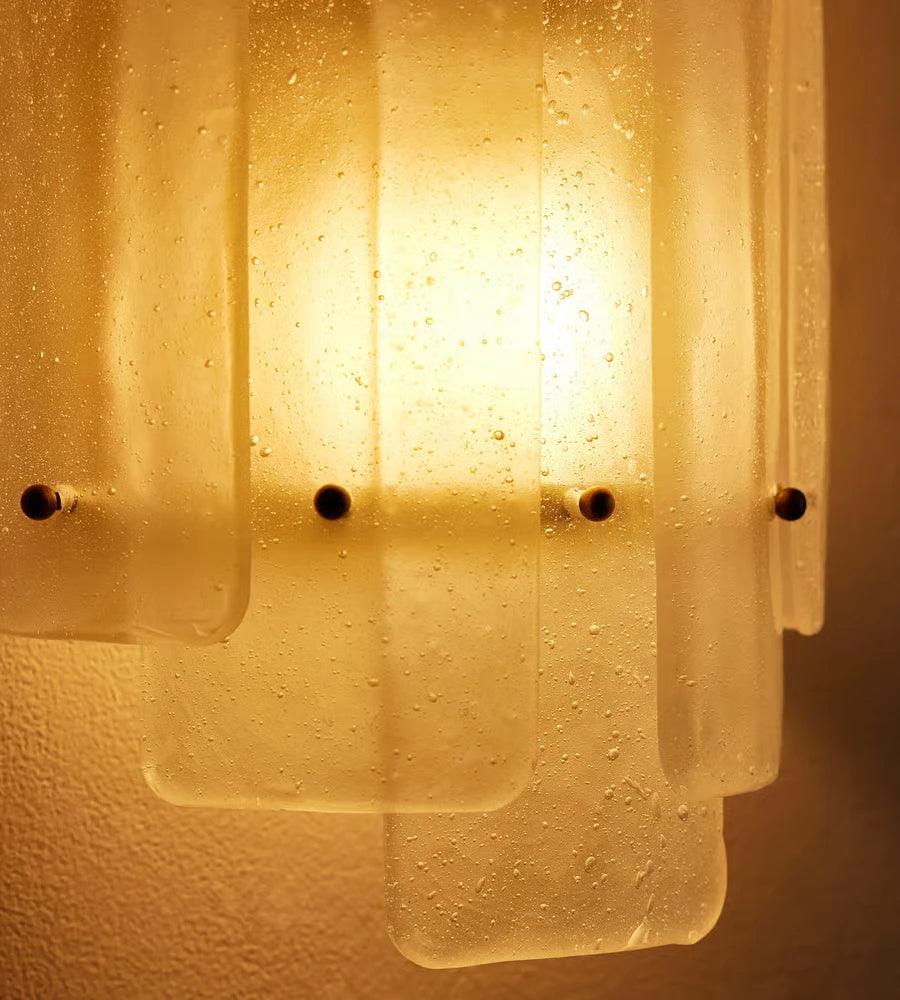 Close Up View of Textured Ice Glass Panels and Brass Fasteners