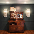 Symmetrical Modern Tiered Ice Glass Wall Sconces Over Credenza