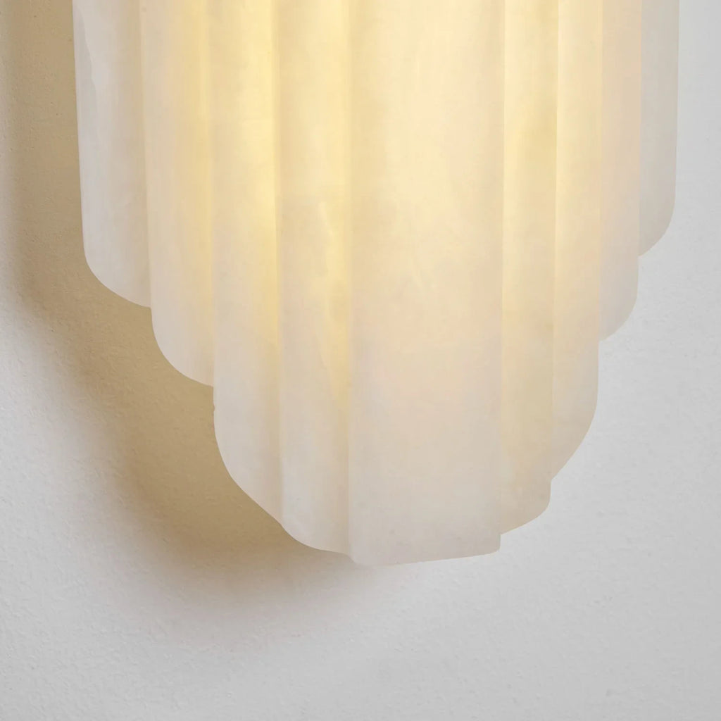 Close Up View of Rounded Bottom Profile and Light Diffusion on Alabaster Wall Sconce