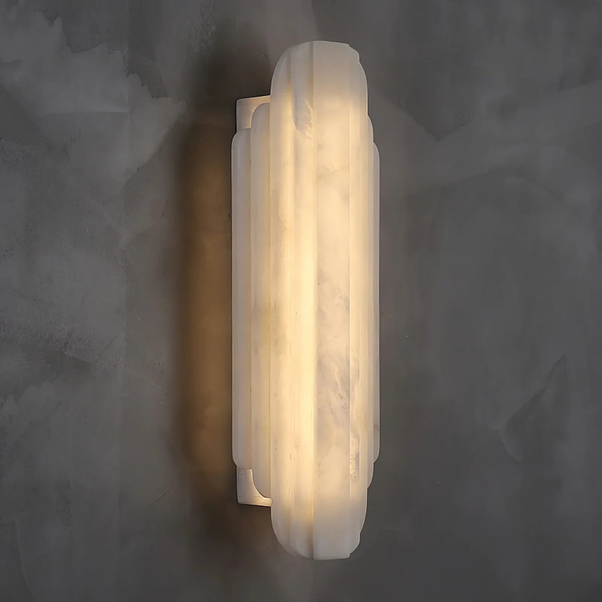 Side View of Illuminated Modern Tiered Alabaster Wall Sconce Studio Shot