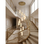 Modern Brass Alabaster Chandelier Over Curved Staircase