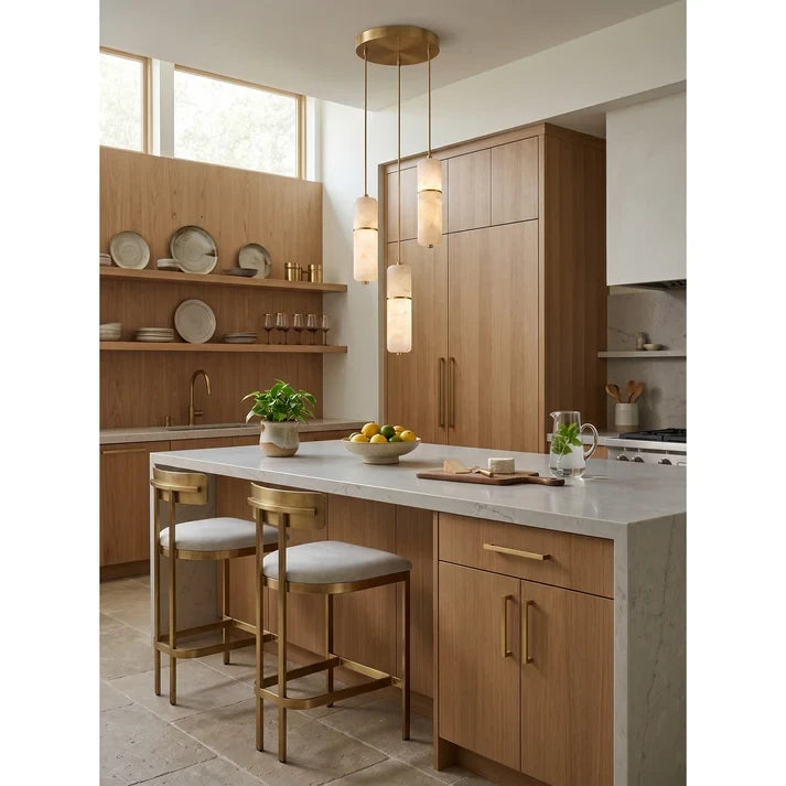 Pair of Alabaster Cylinder Pendant Lights Over Kitchen Island