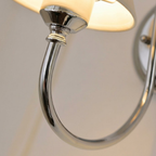 Close Up View of Curved Polished Chrome Gooseneck Light Arm