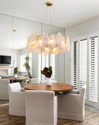 Modern Brass Crystal Irregular Disc Chandelier Over Round Dining Table