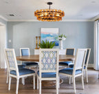 Modern Antique Brass Amber Disc Chandelier in Formal Dining Room