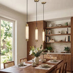 Modern Cylindrical Alabaster Pendant Lights Over Dining Table