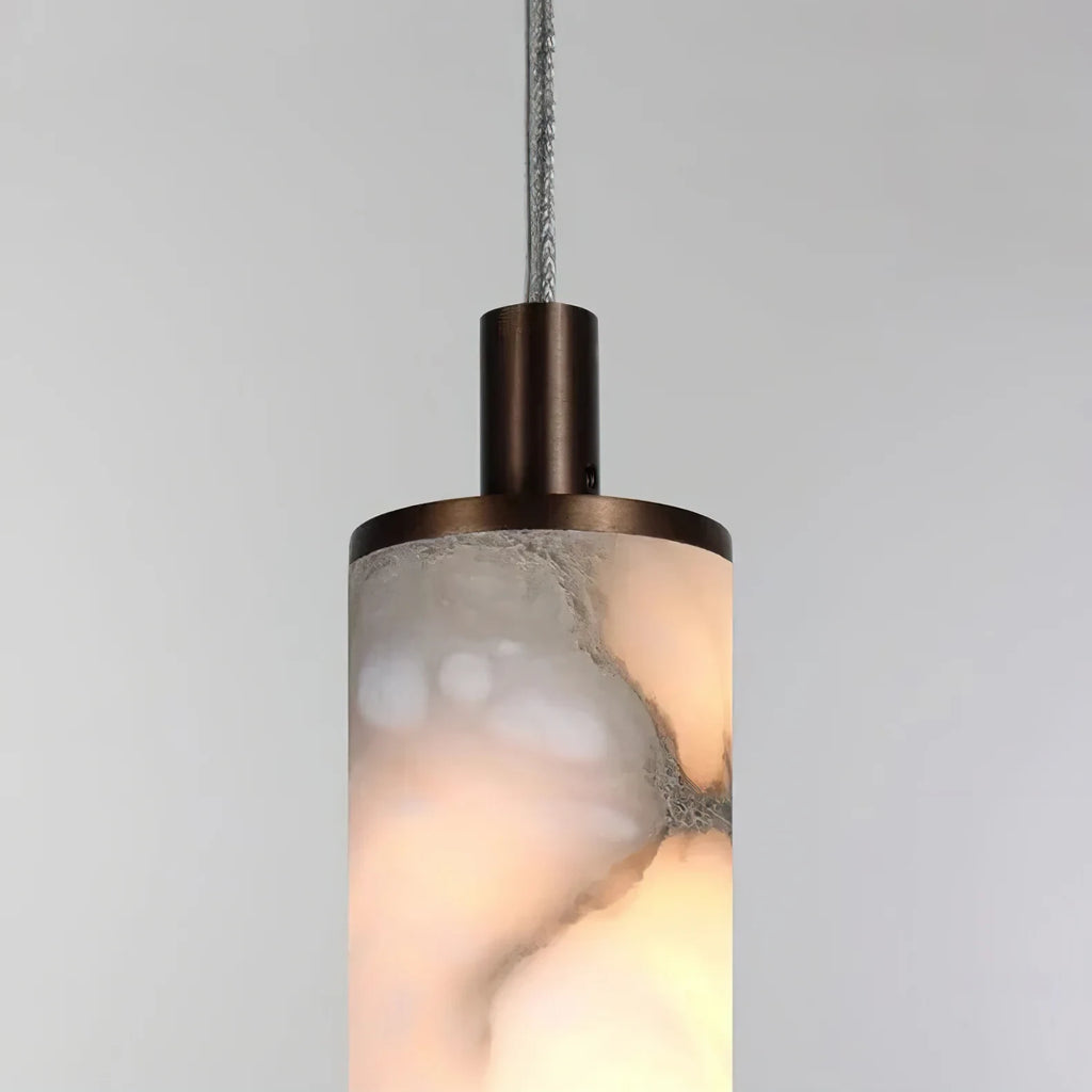 Close Up View of Illuminated Alabaster Cylinder Shade and Natural Stone Veins