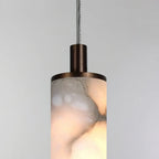 Close Up View of Illuminated Alabaster Cylinder Shade and Natural Stone Veins
