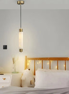 Modern Cylindrical Alabaster Pendant Light Over Bedside