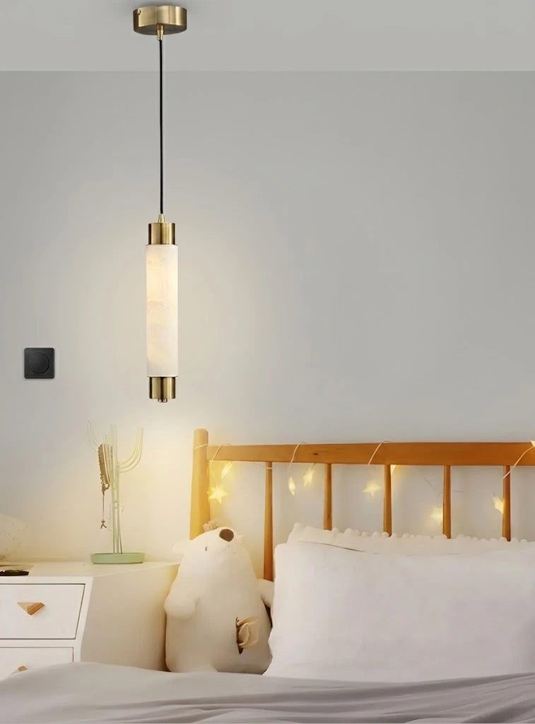 Modern Cylindrical Alabaster Pendant Light Over Bedside