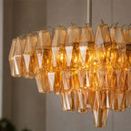 Side View of Illuminated Modern Amber Faceted Glass Chandelier