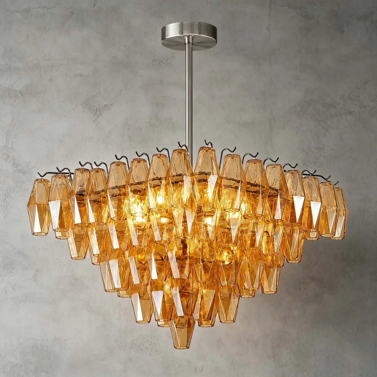 Front View of Illuminated Modern Cascading Amber Faceted Glass Chandelier