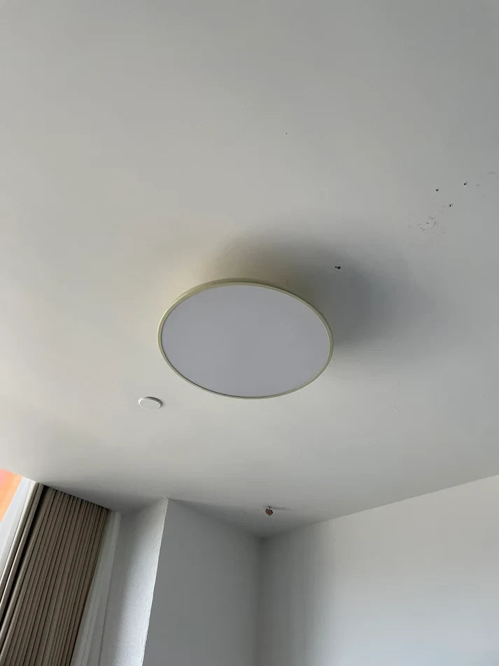 Modern Round Ceiling Light Installed on White Ceiling